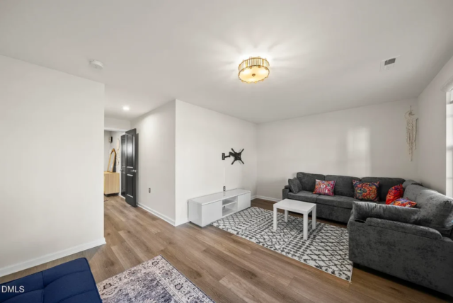 Spacious living area in modern 2023 Raleigh townhome